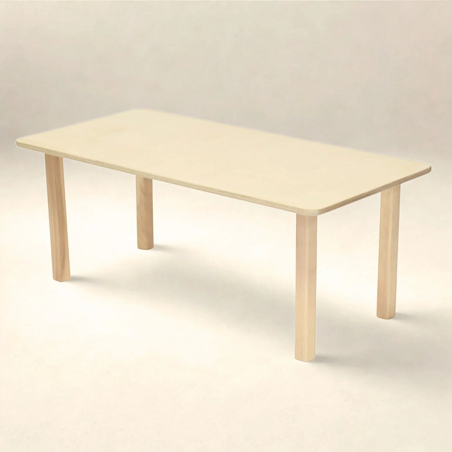 Rectangular preschool table with light wood finish and rounded edges on a neutral background