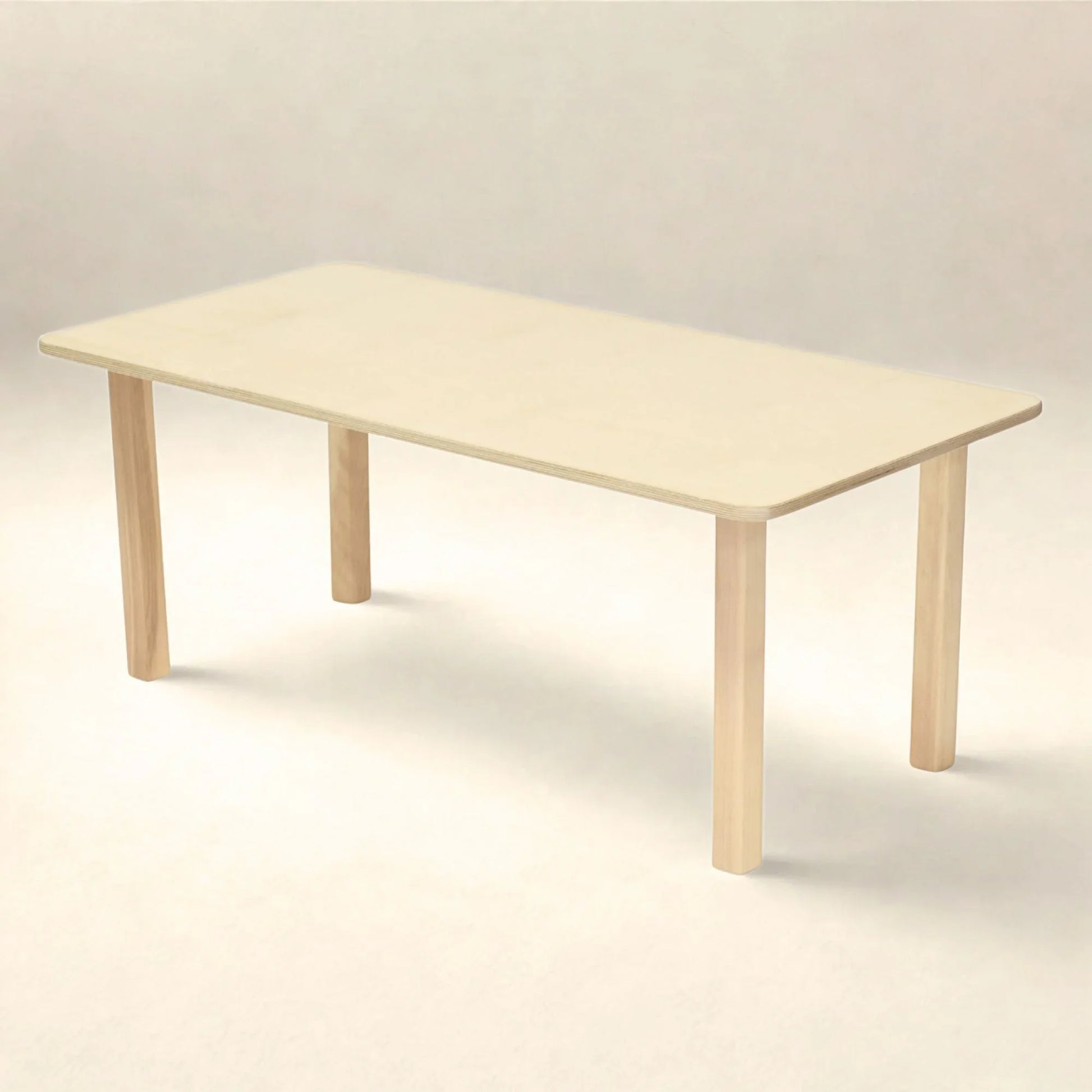 Rectangular preschool table with light wood finish and rounded edges on a neutral background