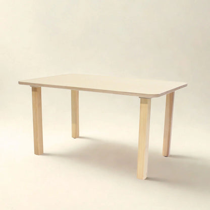Rectangular preschool table with light wood legs and smooth beige top, classroom furniture