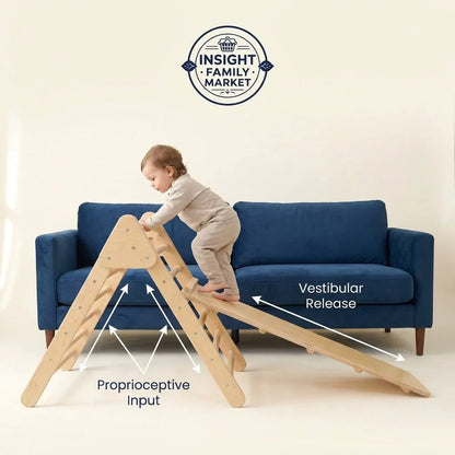 Toddler climbing wooden sensory play gym near blue couch, promoting neurodiverse support