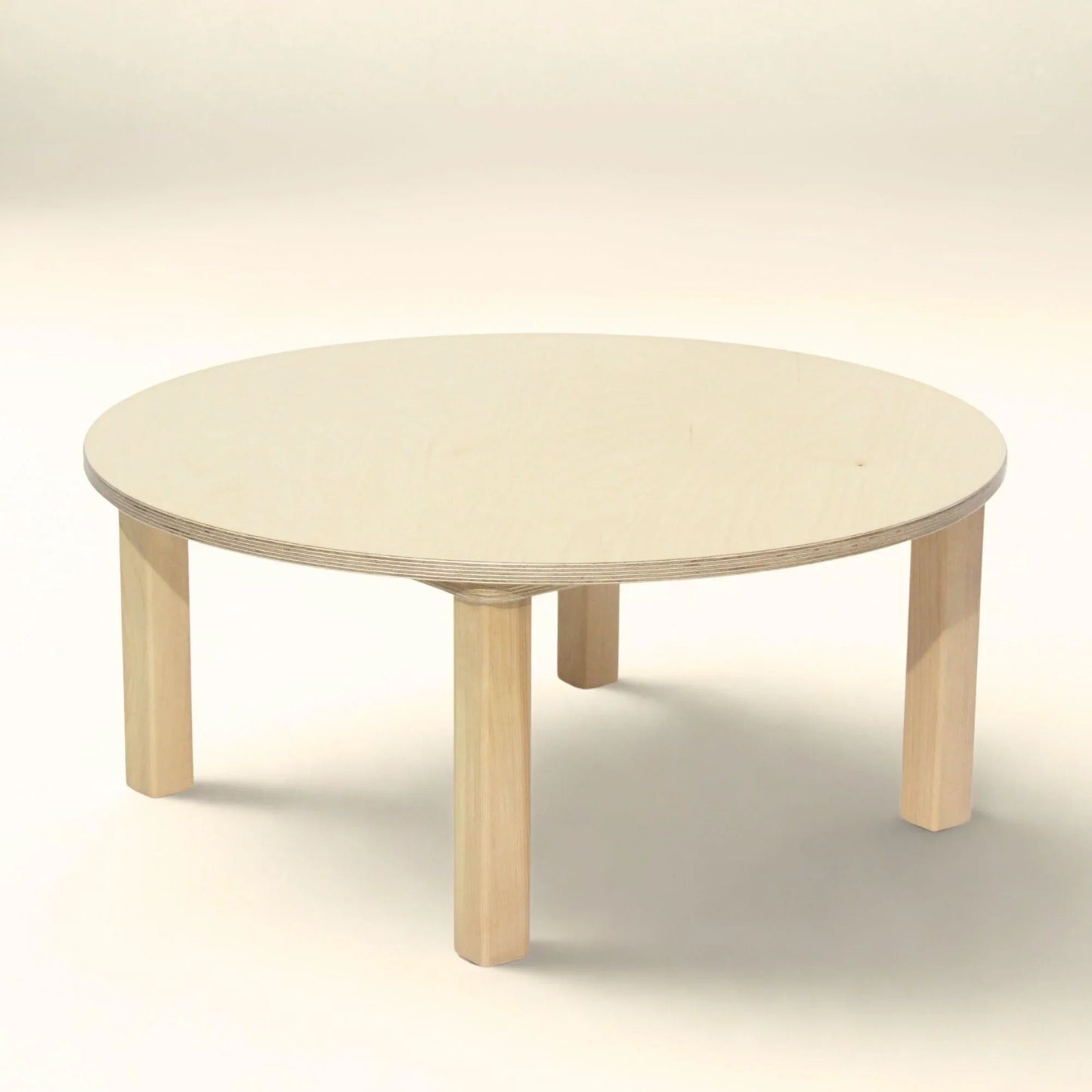 Light wood toddler round table with four legs, minimalistic and child-friendly design