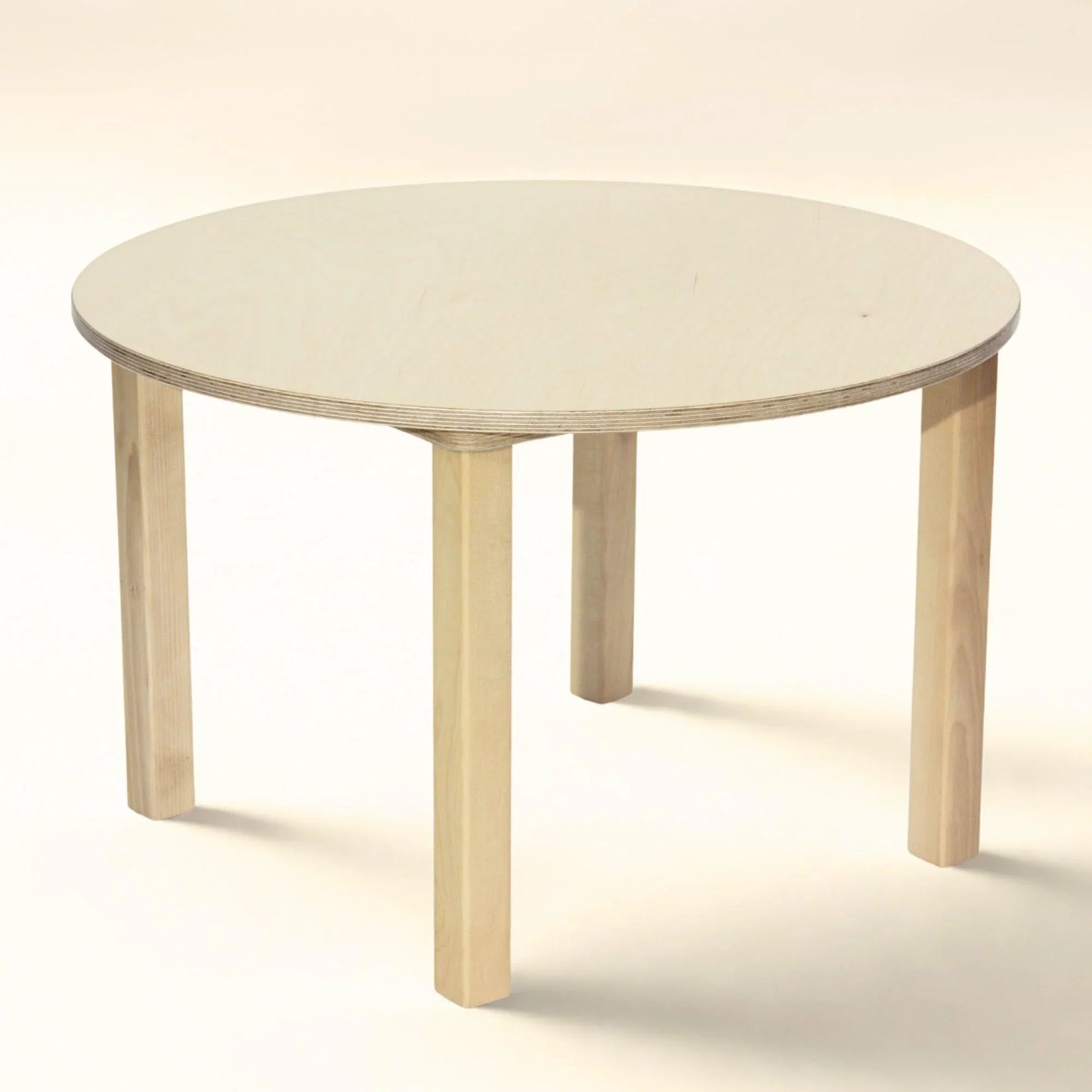 Light wood preschool round table with four sturdy legs, child-friendly design