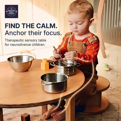 Young child playing with metal sensory bowls at a therapeutic sensory table for focus support
