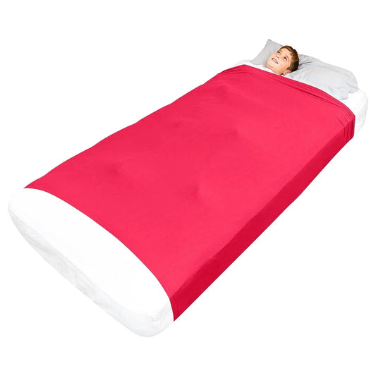 Child lying in a red sensory compression bedsheet for calming sleep support