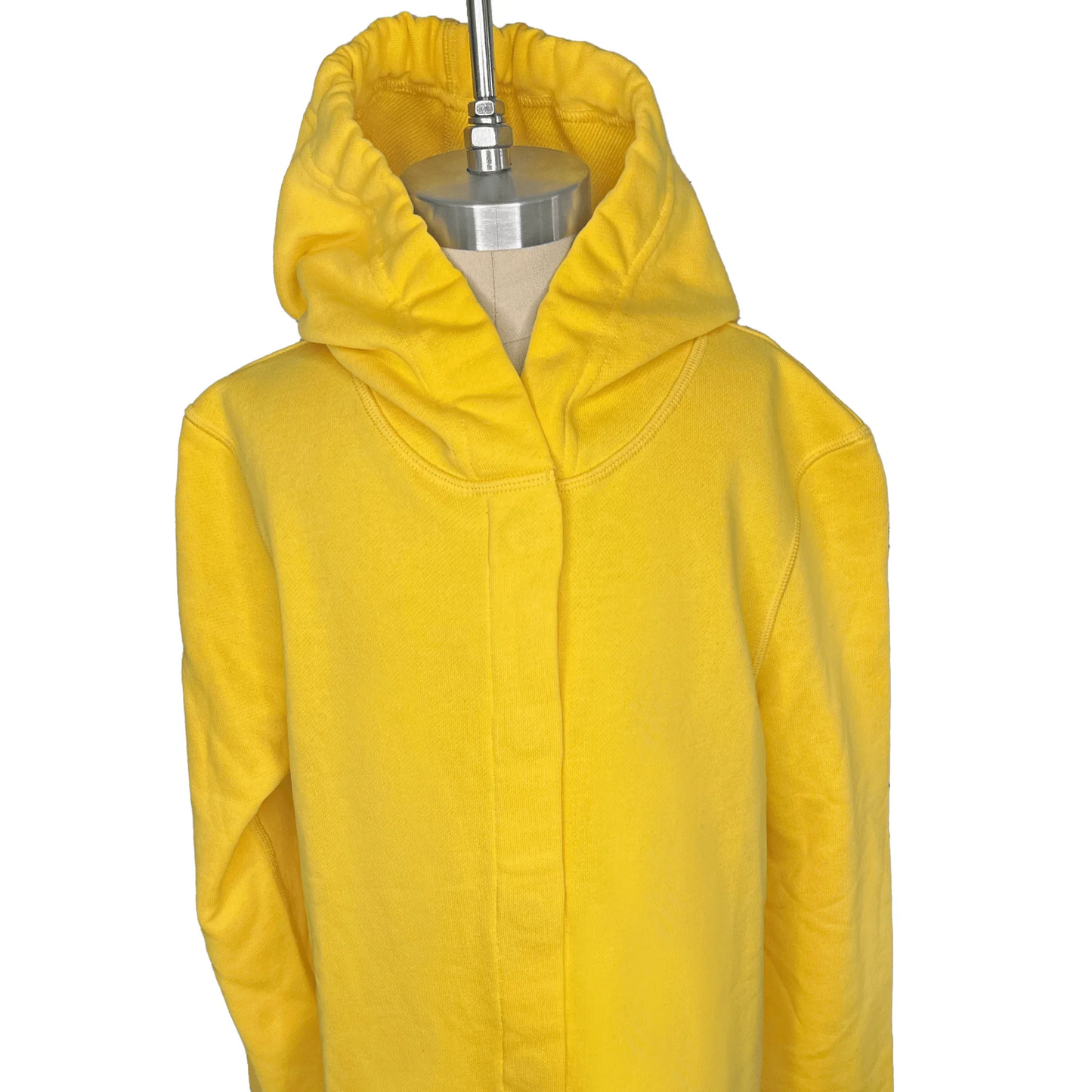 Front view of a sensory-friendly yellow hoodie on a mannequin.