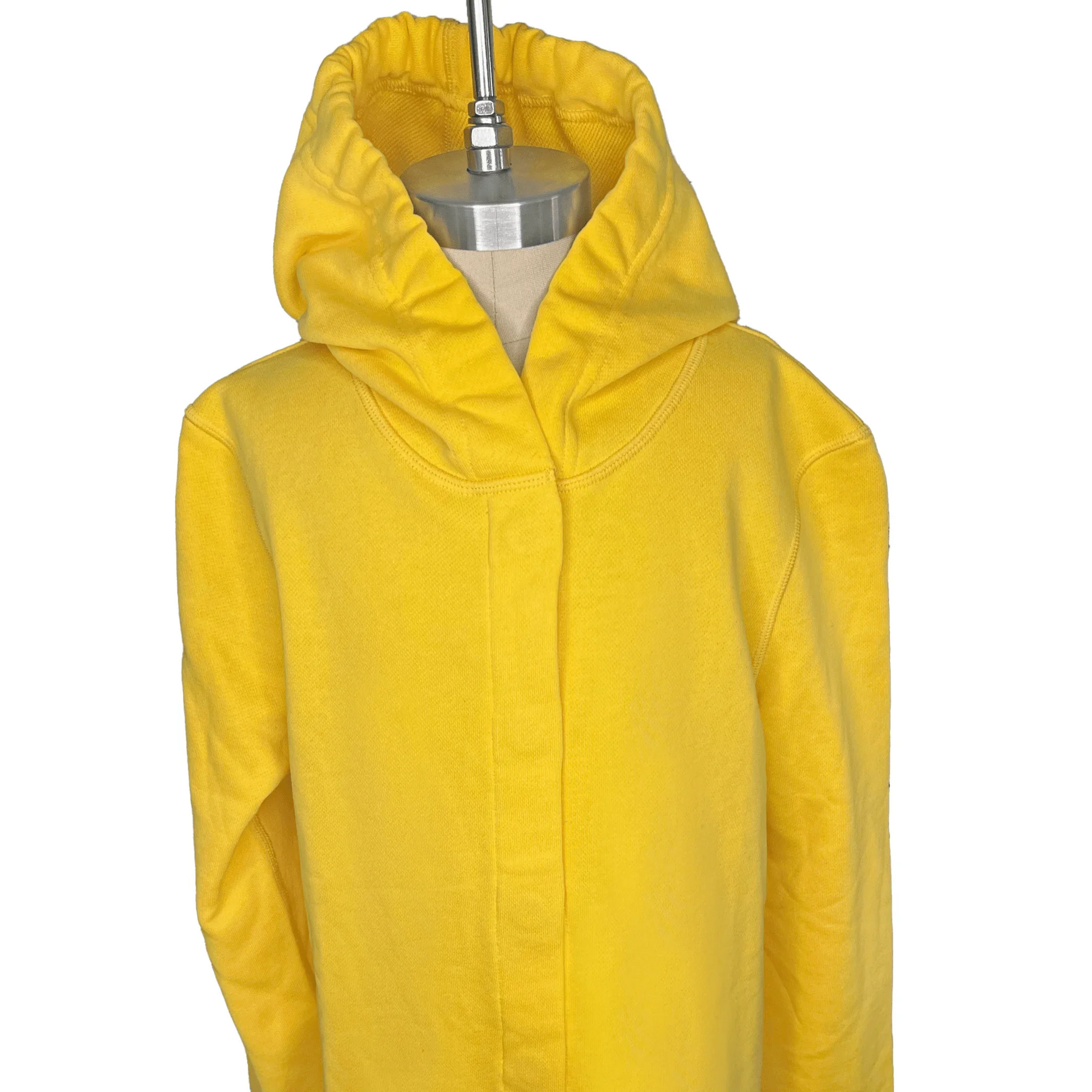 Front view of a sensory-friendly yellow hoodie on a mannequin.