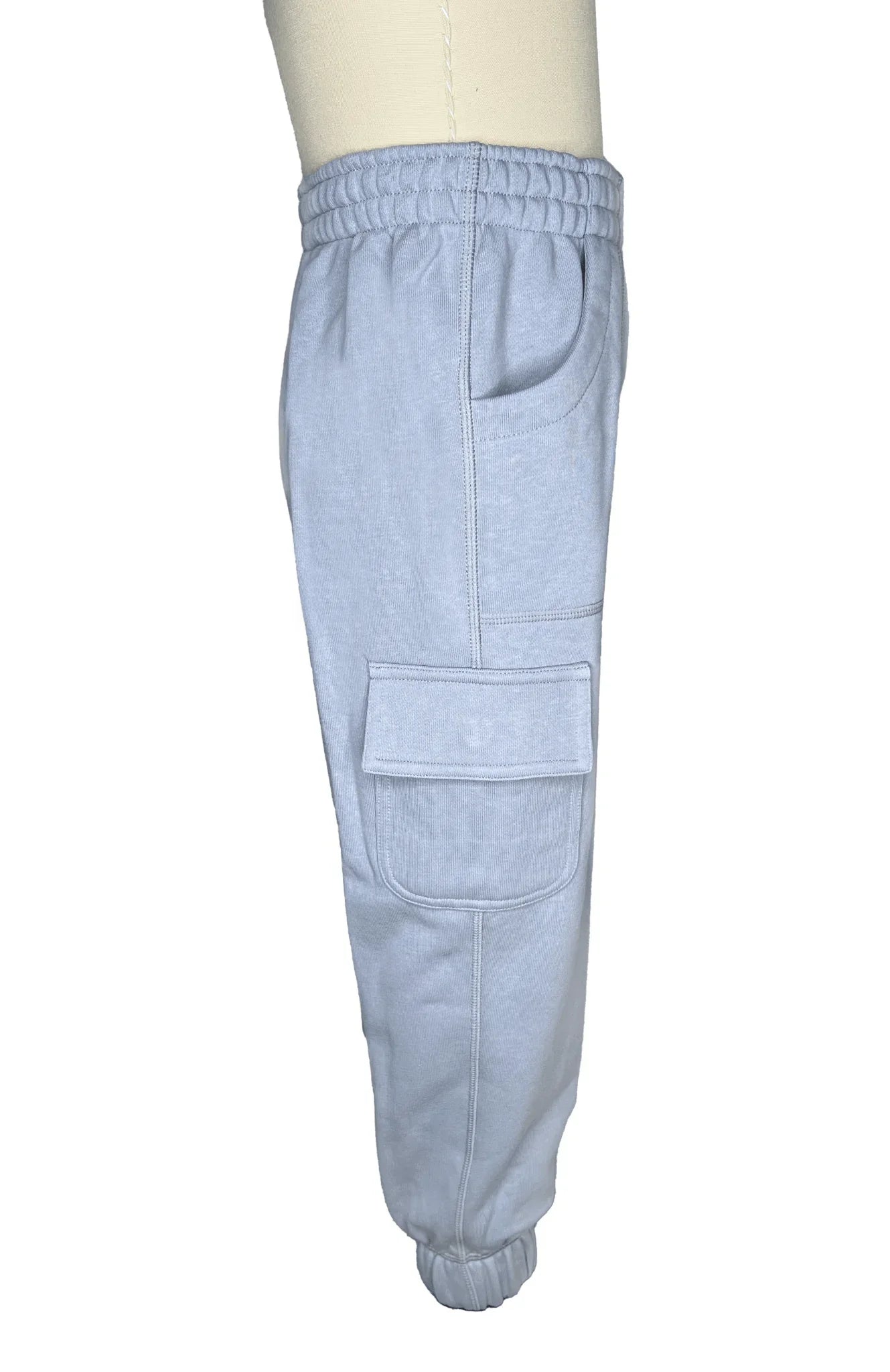 Light gray sensory-friendly jogger pants with elastic waistband and cargo pocket, side view