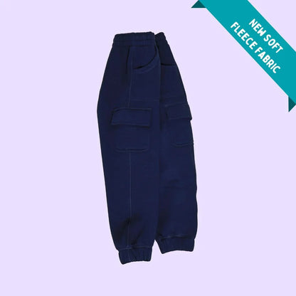 Navy blue sensory-friendly fleece cargo pants with elastic waistband and pockets on light purple background.