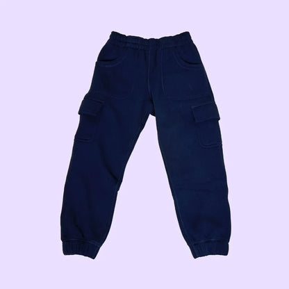 Navy blue sensory-friendly kids cargo jogger pants with pockets on a light purple background