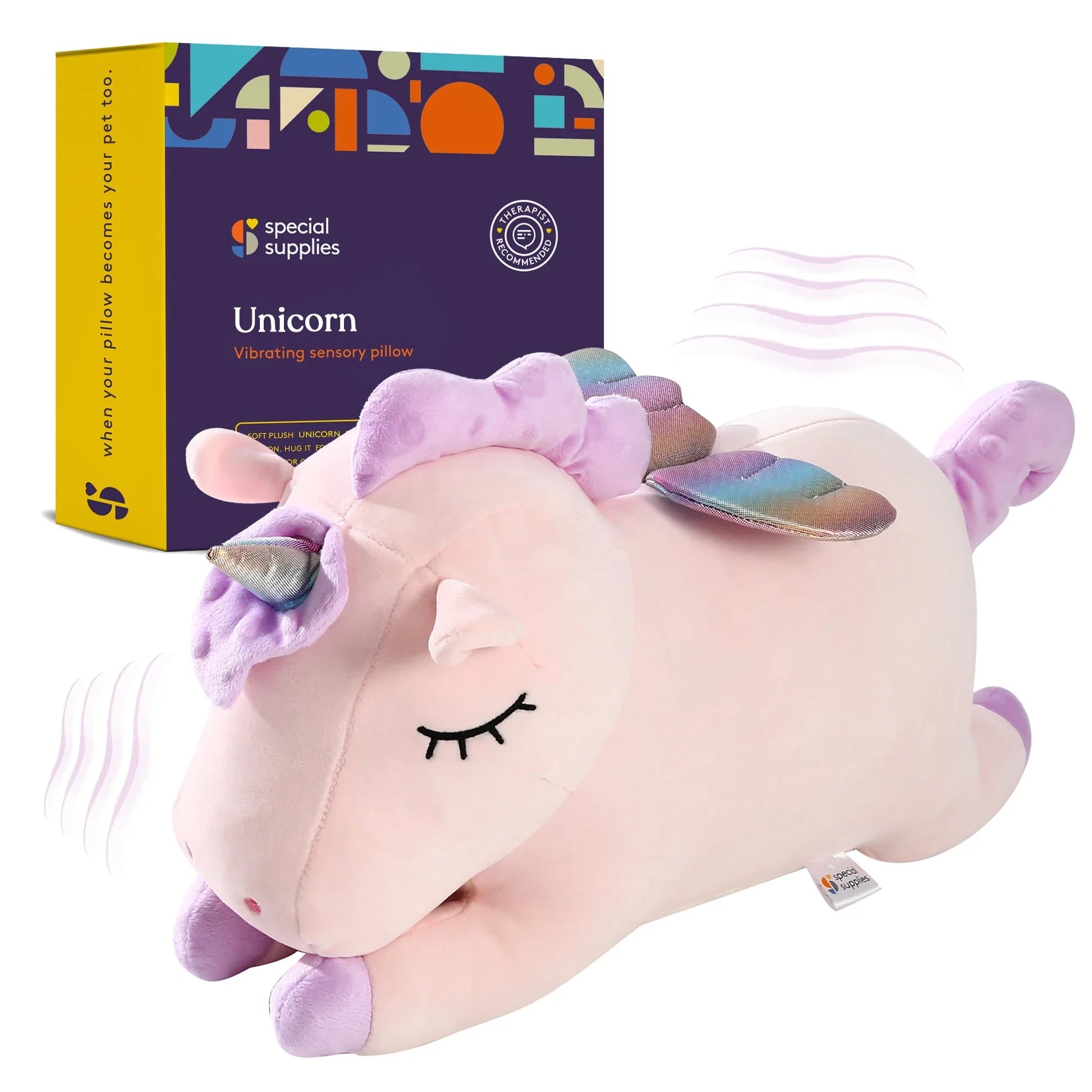 Plush unicorn vibrating sensory pillow with pastel purple mane, rainbow wings, and product box