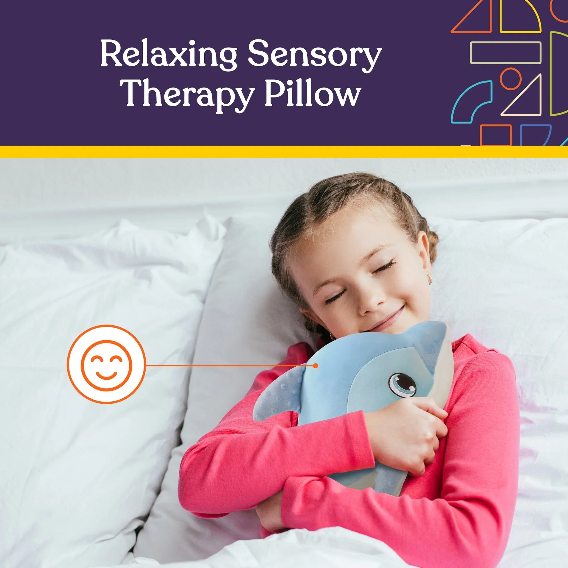 Child smiling and hugging blue sensory therapy pillow in bed