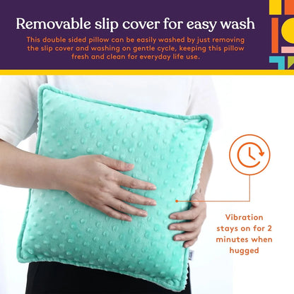 Person holding a blue sensory pillow with removable cover and vibration feature
