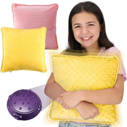 Child hugging yellow sensory pillow, pink pillow and purple sound machine for sensory support