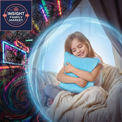 Smiling child hugging a blue sensory pillow in a cozy, calming sensory-friendly space