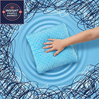 Child's hand touching a blue textured sensory pillow, calming sensory overload