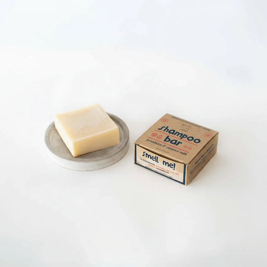 Probiotic coconut milk shampoo bar and box on white background, eco-friendly hair care
