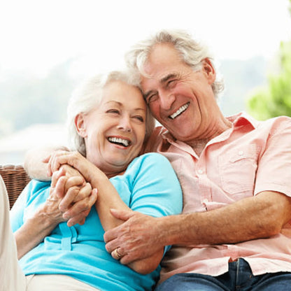 Smiling senior couple hugging and laughing outdoors, healthy lifestyle, happy aging