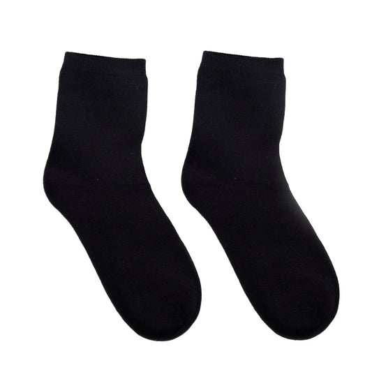 Pair of black sensory-friendly crew socks on white background
