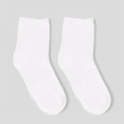 Pair of plain white sensory-friendly crew socks on light background