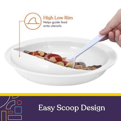 White adaptive plate with high low rim, easy scoop design, hand using utensil with pasta.