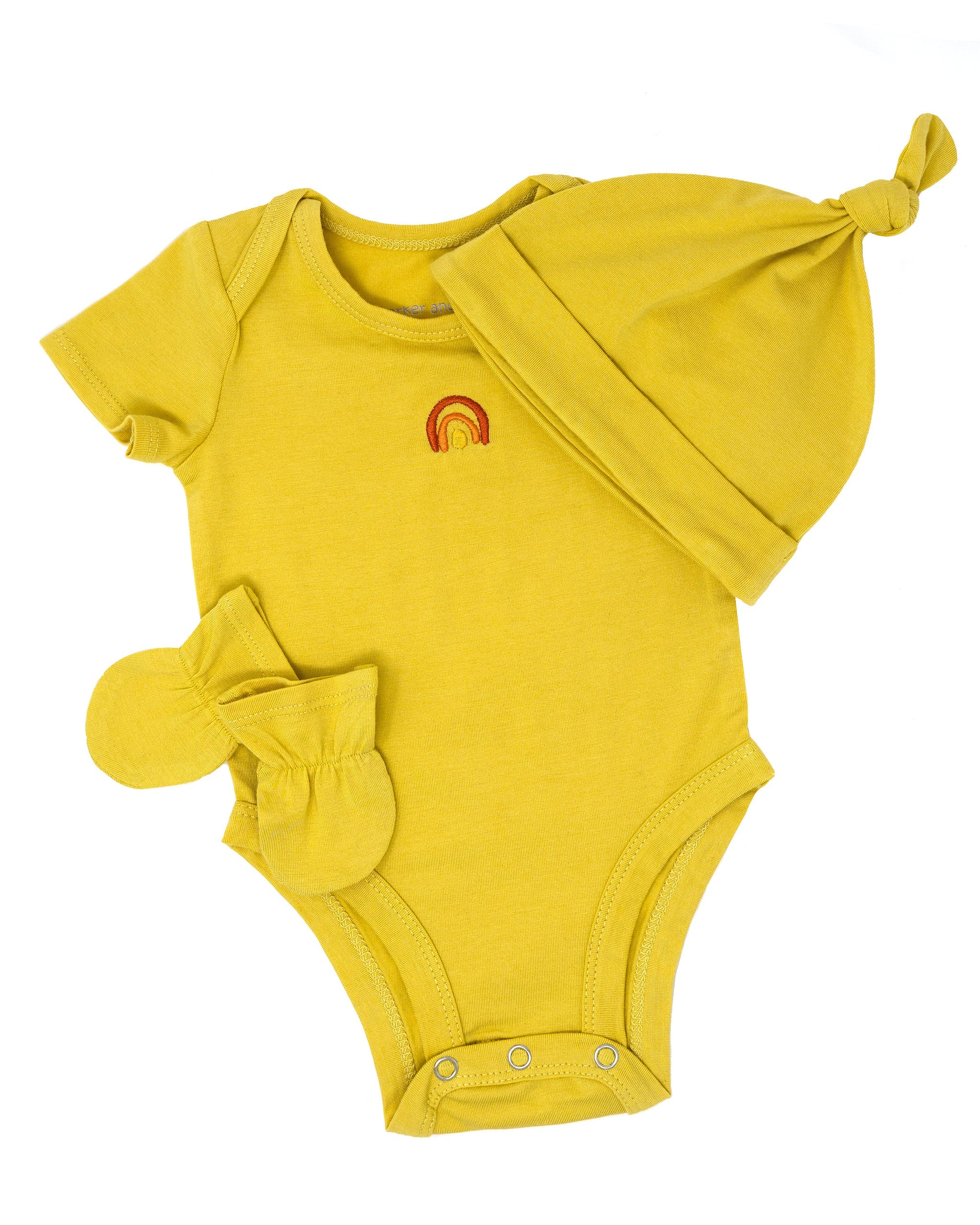 Yellow baby onesie with matching hat and booties on a white background