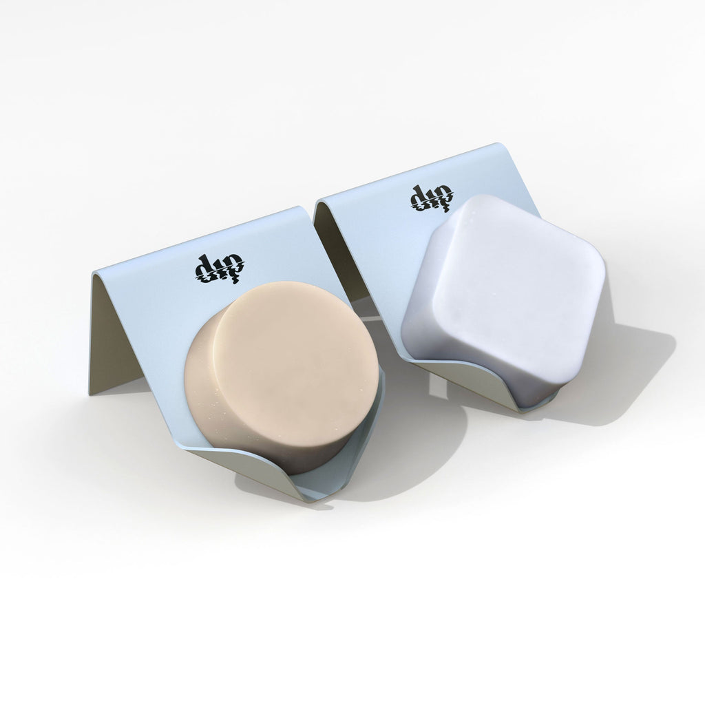 Two small containers with a beige lid and blue bases on a white background