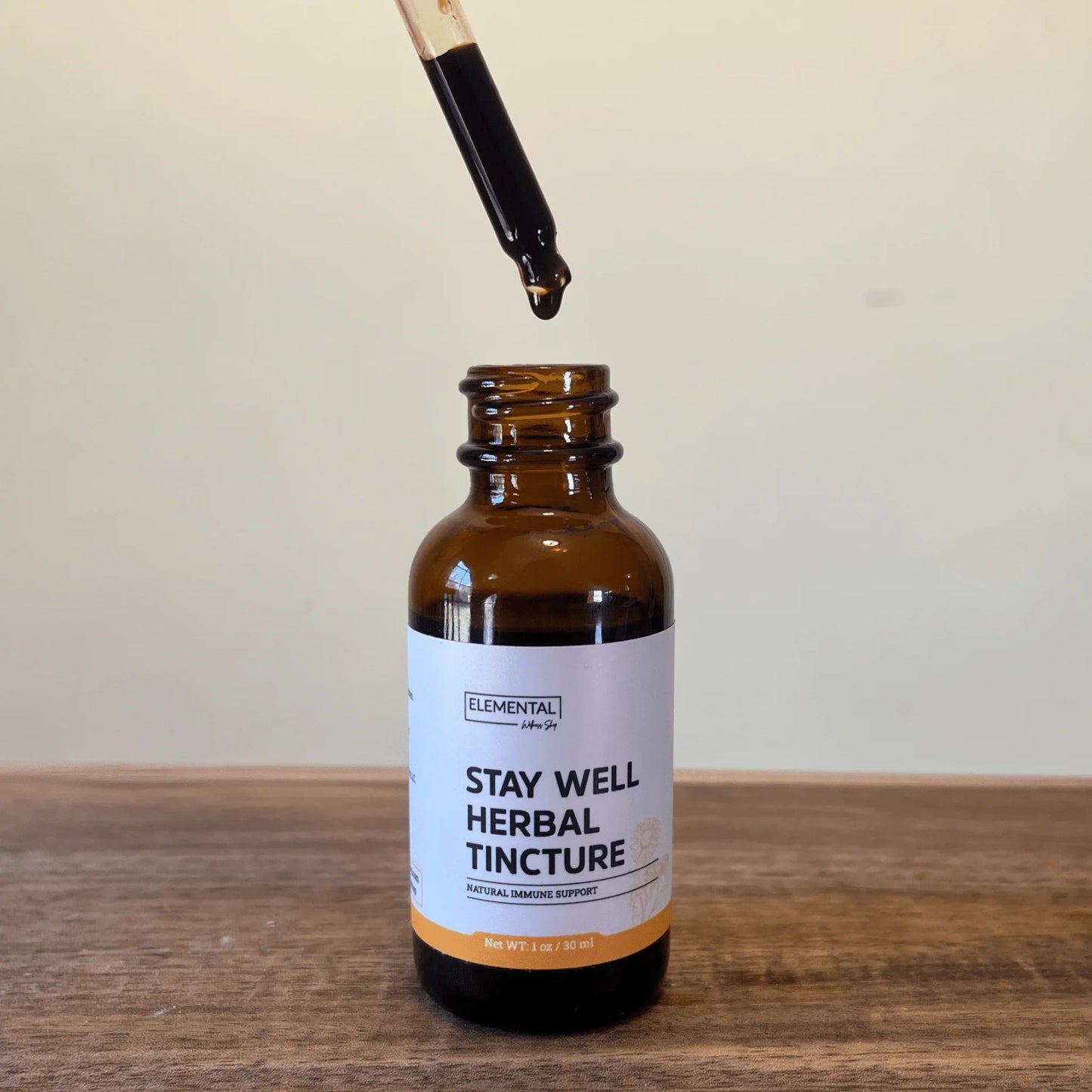Stay Well Herbal Tincture dropper bottle for natural immune support on wood table