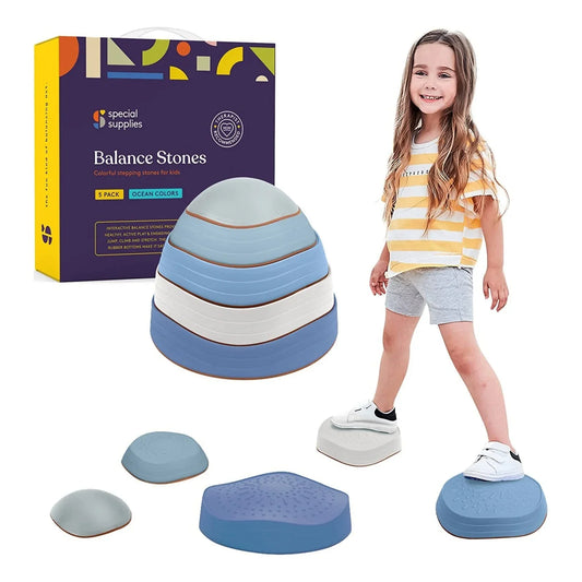 Child playing on sensory balance stones in ocean colors, sensory integration toy displayed.