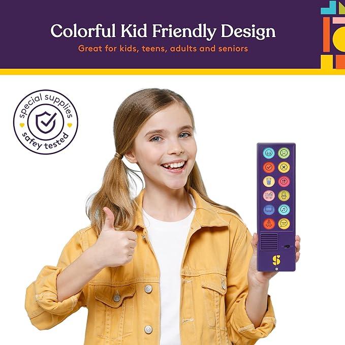 Smiling child holding colorful sensory communication device, giving thumbs up