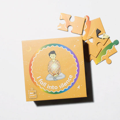 24-piece mindfulness puzzle box with meditating child illustration and 'I fall into silence' text.