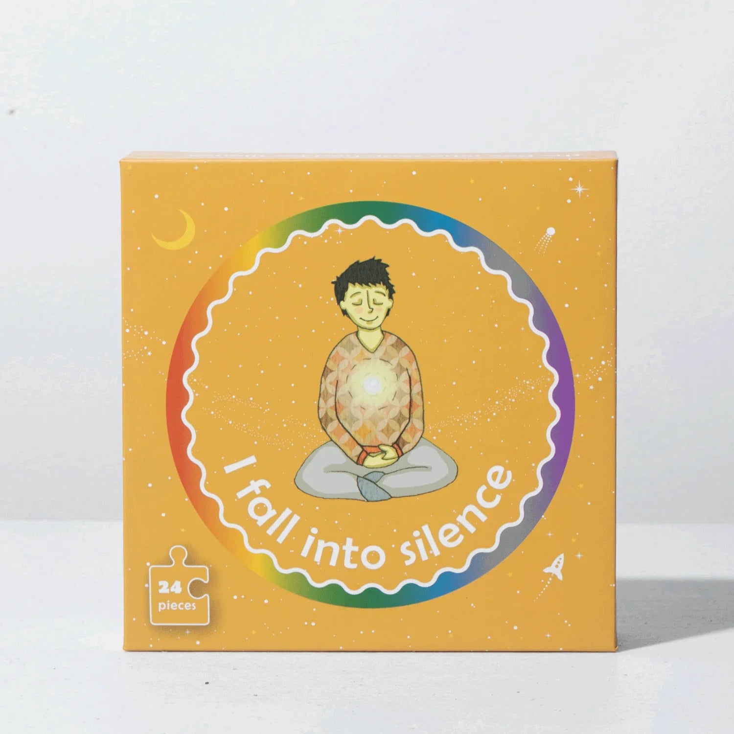 Mindfulness puzzle box with illustration of child meditating, labeled 'I fall into silence,' 24 pieces