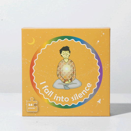 Mindfulness puzzle box with illustration of child meditating, labeled 'I fall into silence,' 24 pieces