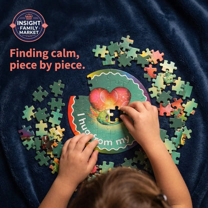 Child assembling colorful sensory-friendly puzzle on a navy blanket, promoting calm focus