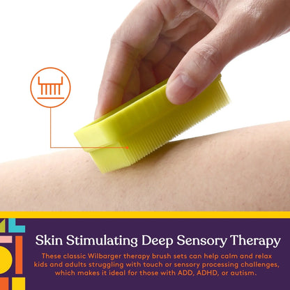 Hand using yellow sensory therapy brush on skin for deep sensory stimulation