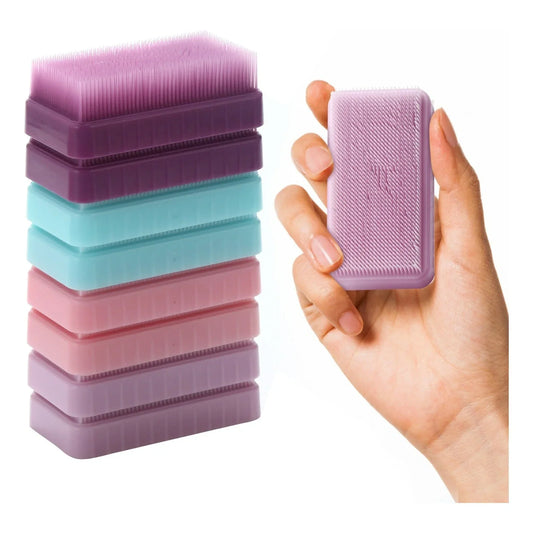 Stack of colorful sensory brushes and hand holding a textured sensory tool for tactile input