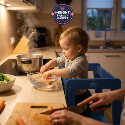 Young child standing in kitchen helper tower washing carrots, family meal prep scene