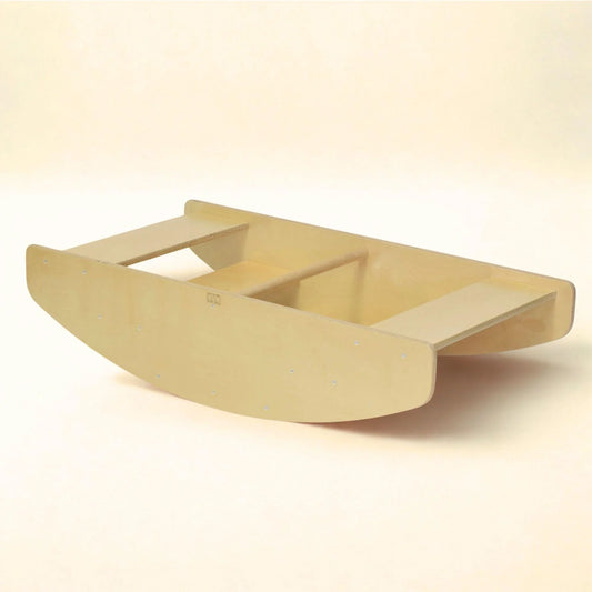 Wooden toddler rocking boat and steps sensory play equipment on neutral background