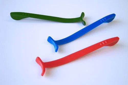 Three colorful sensory chew sticks in green, blue, and red on a white background.