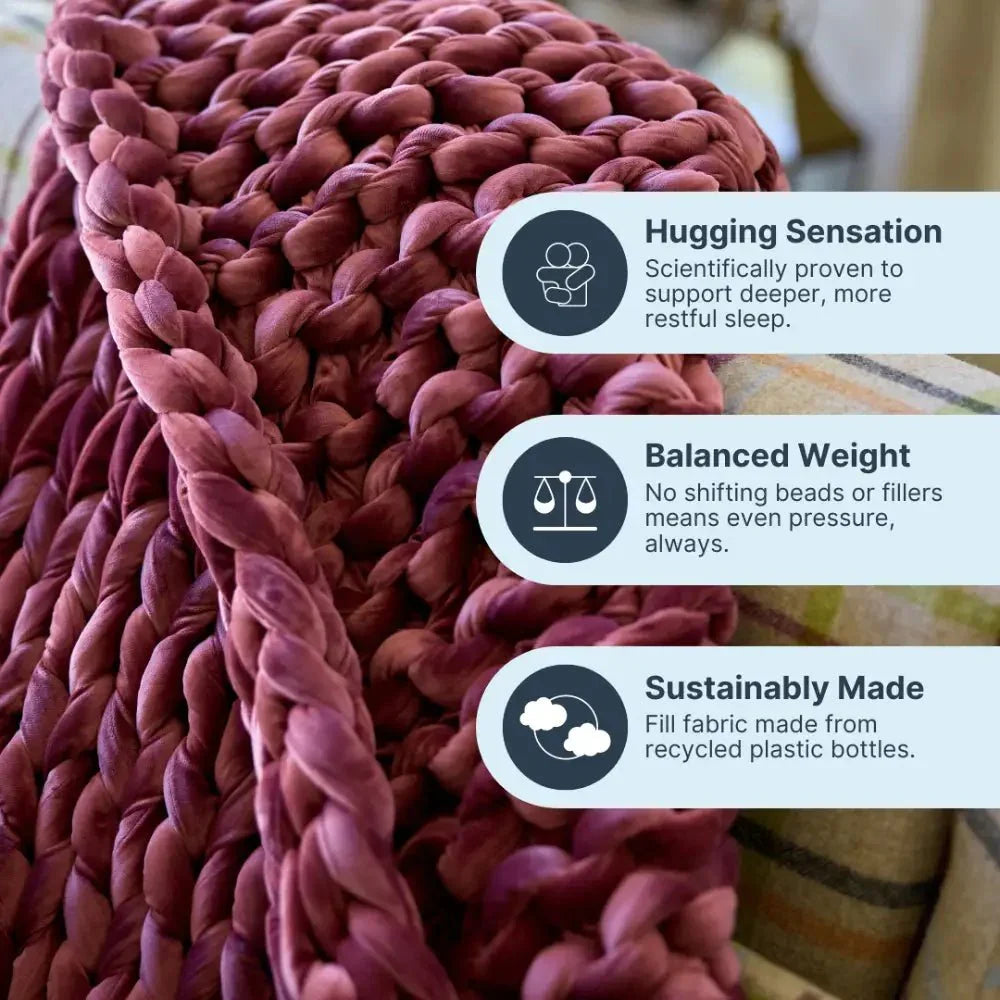 Ruby velvet weighted blanket with chunky knit texture on a sofa, highlighting sleep and eco benefits.