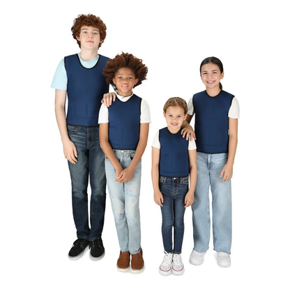 Four children wearing blue sensory compression vests over white shirts, standing together