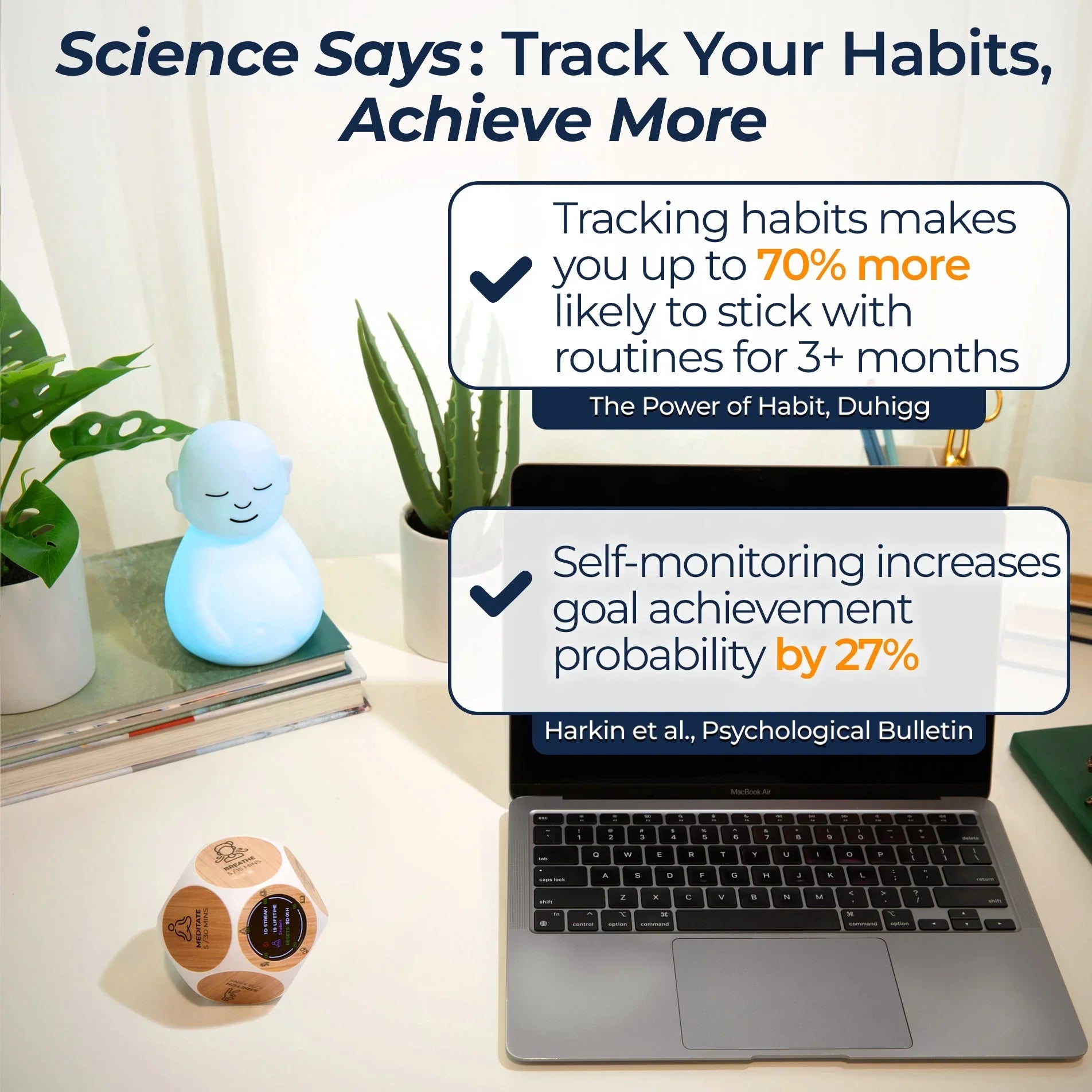 Habit tracking workspace with wooden dice, glowing blue meditation figure, laptop, and plants.