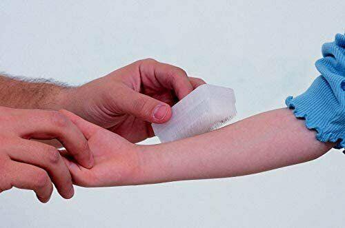 Adult wrapping gauze bandage on child's arm, sensory-friendly first aid care