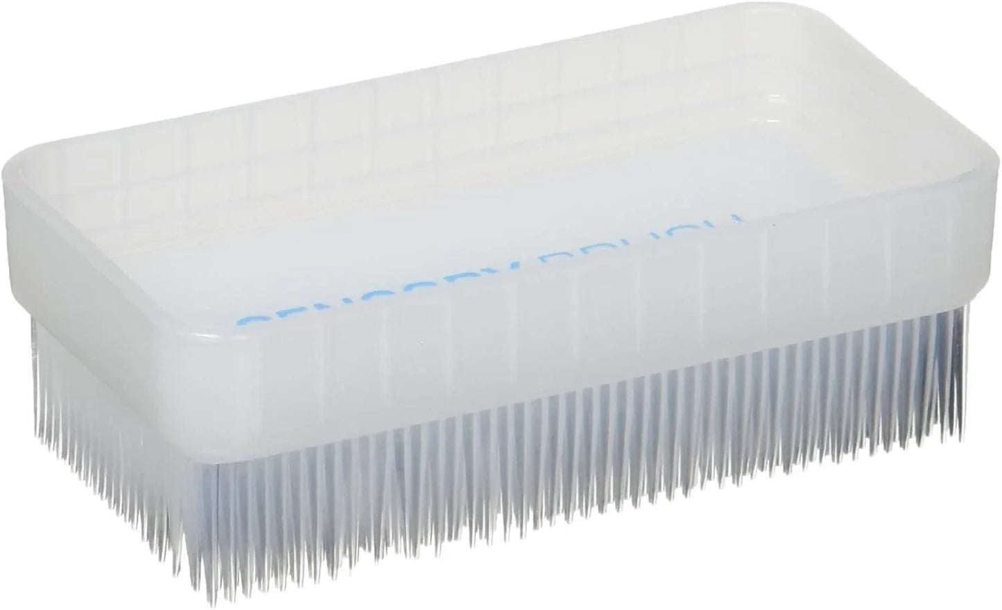 White rectangular sensory brush with soft bristles for tactile therapy and sensory support.