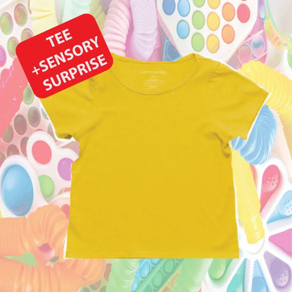 Yellow sensory-friendly kids tee with sensory toys background and Tee + Sensory Surprise text.